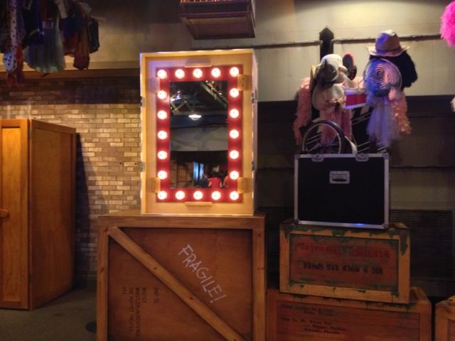 This mirror has been installed for Disney's Story Maker. It sits on a crate that says Fragile! Ship to: Walter Whistler-in residence; The Muppet Theater, USA. It's a reference to Walter, the newest muppet from the recent movie.