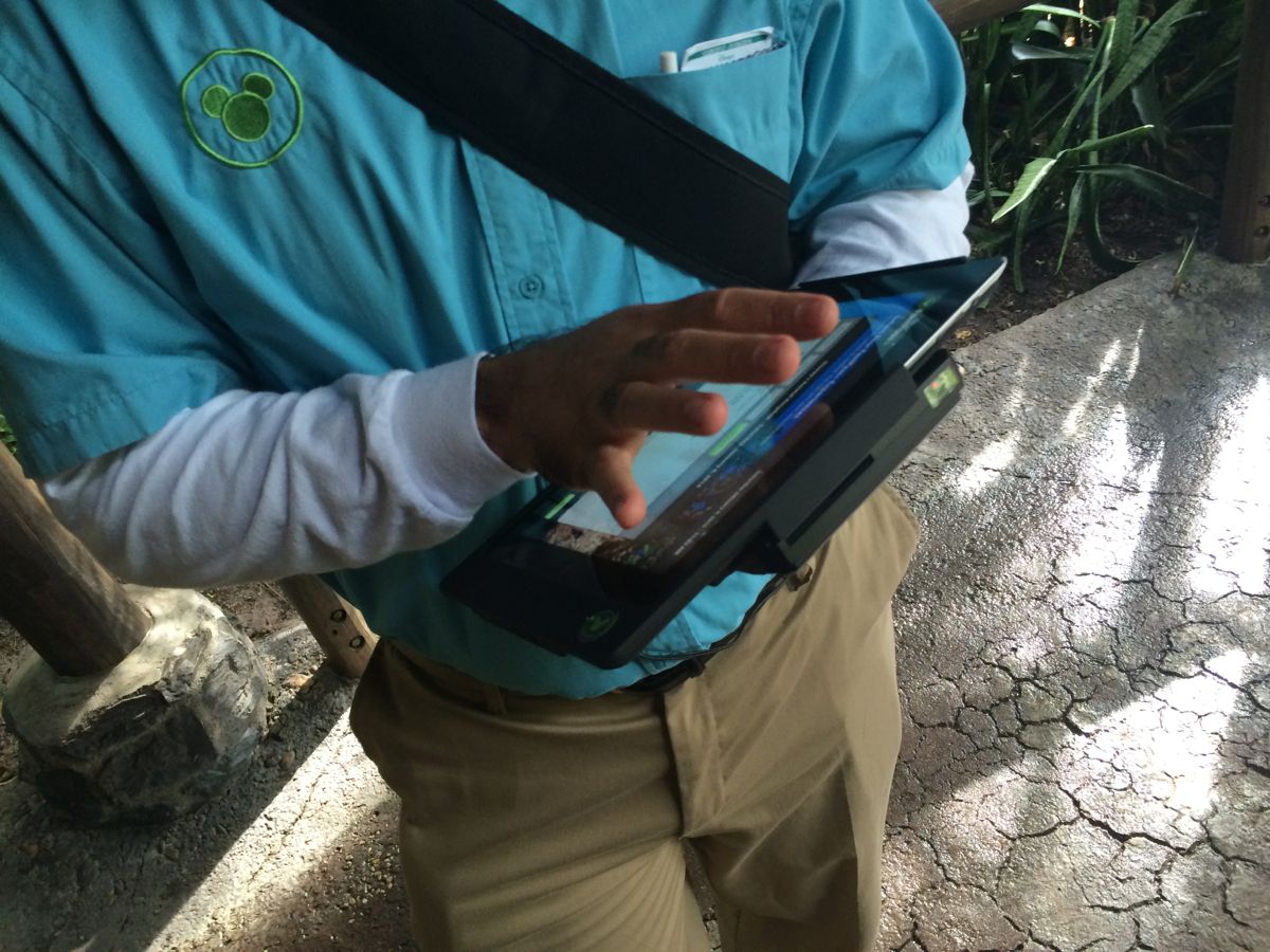 A Disney Cast Member helping non-resort guests with their FastPass+ choices. Photo by J. Jeff Kober