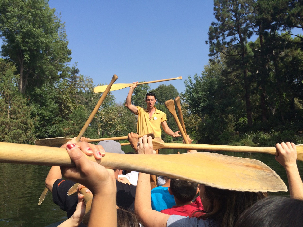 A cast member leads the instruction for canoeing around the Rivers of America at Disneyland. Photo by J. Jeff Kober.